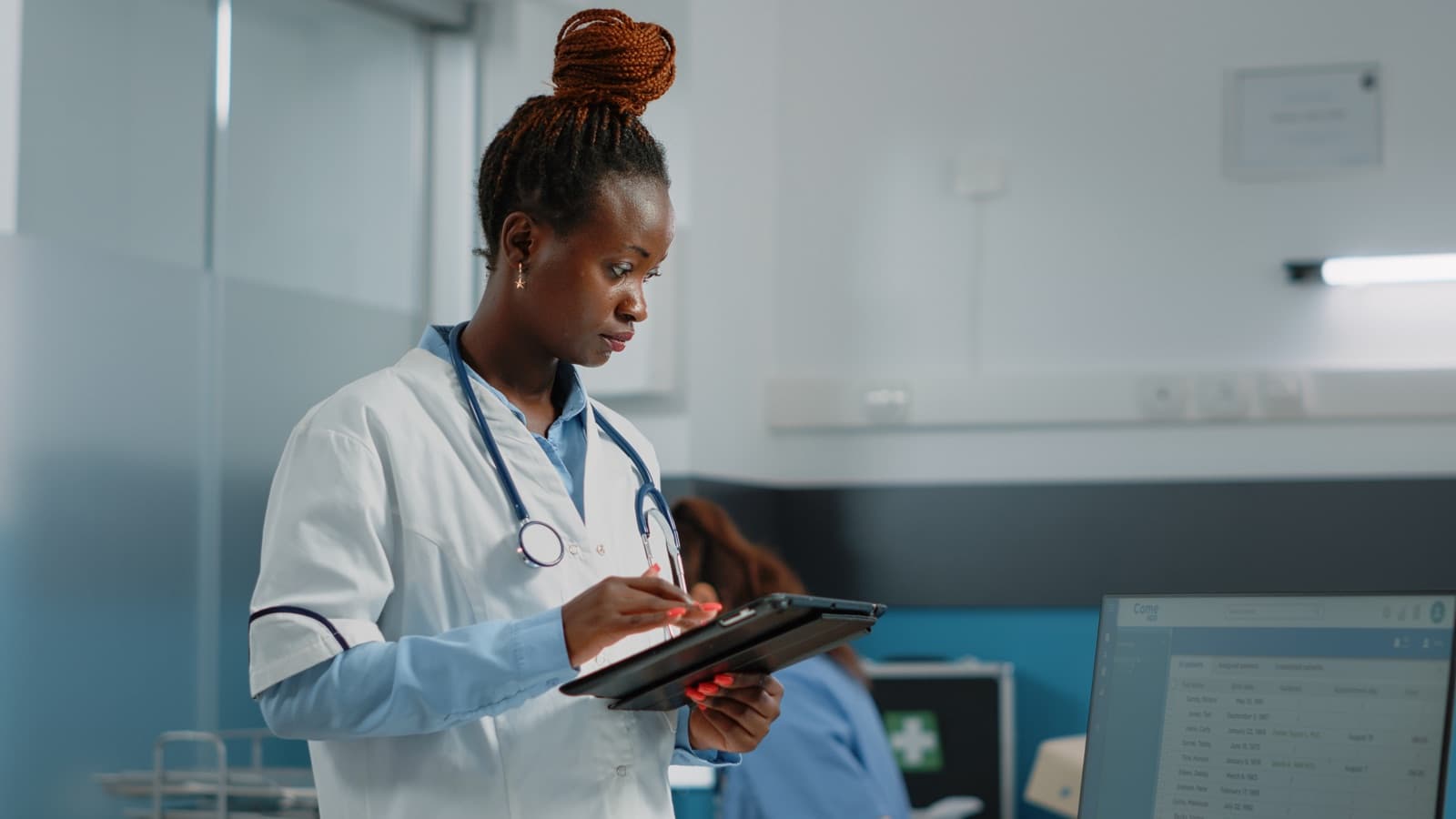 A clinician using a tablet